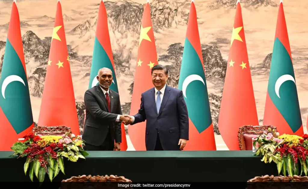 Maldives President Mohamed Muizzu shaking hands with Chinese President Xi Jinping in Beijing
